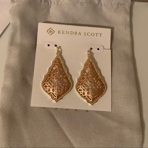 Kendra Scott earrings in gold and rose gold metal